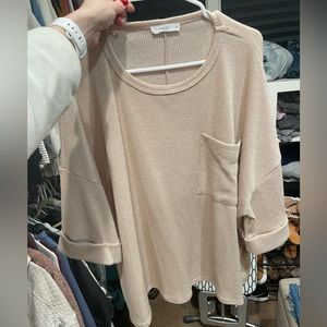 Oversized short sleeved knit sweater with pocket